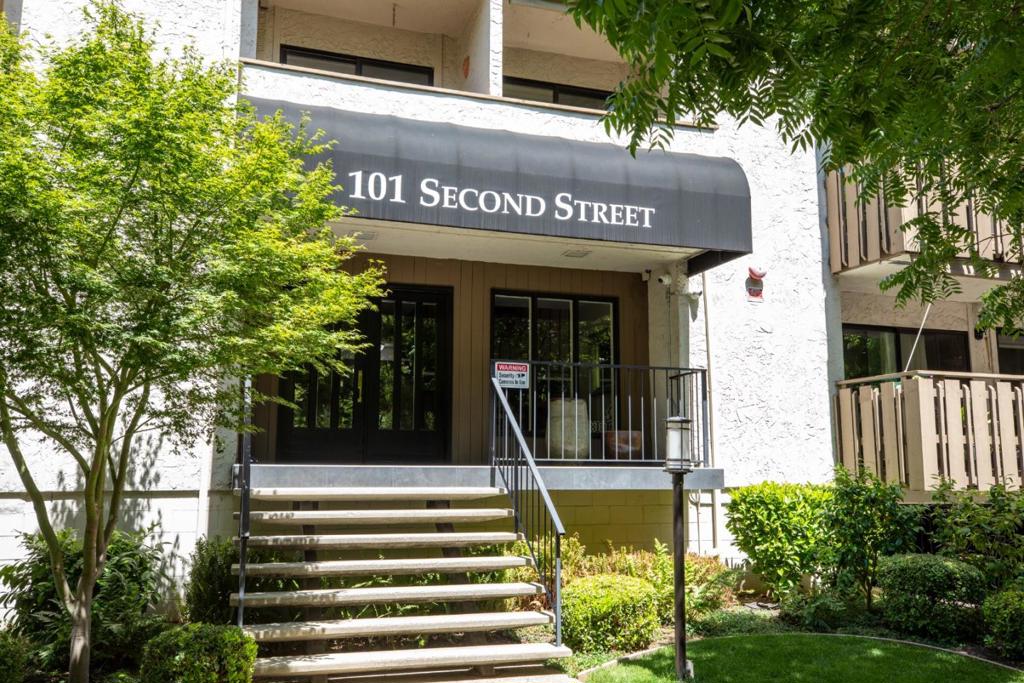 Step into refined comfort in this beautifully remodeled 1-bedroom, 1-bath condo in a sought-after downtown Los Altos complex. Stylish features include gleaming marble floors, a solid-surface kitchen with abundant cabinetry, accent-lit display shelving, breakfast bar, and modern appliances. The kitchen opens to a spacious great room with plenty of room for dining and living areas, accented by a remote-controlled gas log fireplace and a 65" Sony flat-screen TV which conveys with the home. Sliding glass doors lead to a large slate-tiled deck, perfect for al fresco dining or peaceful mornings overlooking the serene community pool. The bedroom also offers direct deck access, and custom mirrored closets with an interior organizer for enhanced storage. Additional amenities include recessed lighting throughout, a full-size in-unit washer and dryer, generous storage, and an updated bath with double sinks. Includes 1 secure underground parking space and one outdoor parking space. HOA dues covers water, garbage, sewer and professional management. The well-maintained community offers security cameras, recently inspected decks, and a tranquil pool setting. Treat yourself to elegant, low-maintenance living close to the vibrant downtown shops, dining, and amenities of North Los Altos.