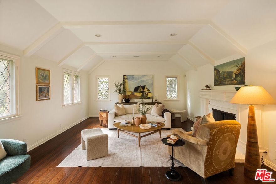 Storybook Charm in the Heart of Cheviot Hills! Overflowing with character, this enchanting 3-bedroom, 2-bath home captures the essence of storybook living. Leaded glass windows, rich wood floors, and timeless architectural details fill each room with warmth and elegance. The spacious living room features a dramatic beamed ceiling and a beautiful fireplace framed by classic moldings, while the formal dining room invites gatherings beneath its timeless charm. A sunlit kitchen features granite counters and an eat-in nook creating a perfect blend of comfort and nostalgia. Three generous bedrooms include a serene primary suite with its own ensuite bathroom and walk in closet. The backyard offers a peaceful escape surrounded by mature landscaping, along with a detached two-car garage that provides excellent potential for rebuilding or adding a guest house or studio. Situated on one of the most sought-after streets in Cheviot Hills and close to neighborhood parks and schools. Sold AS-IS. Call for offers by 12 pm, Wednesday, November 5th!!