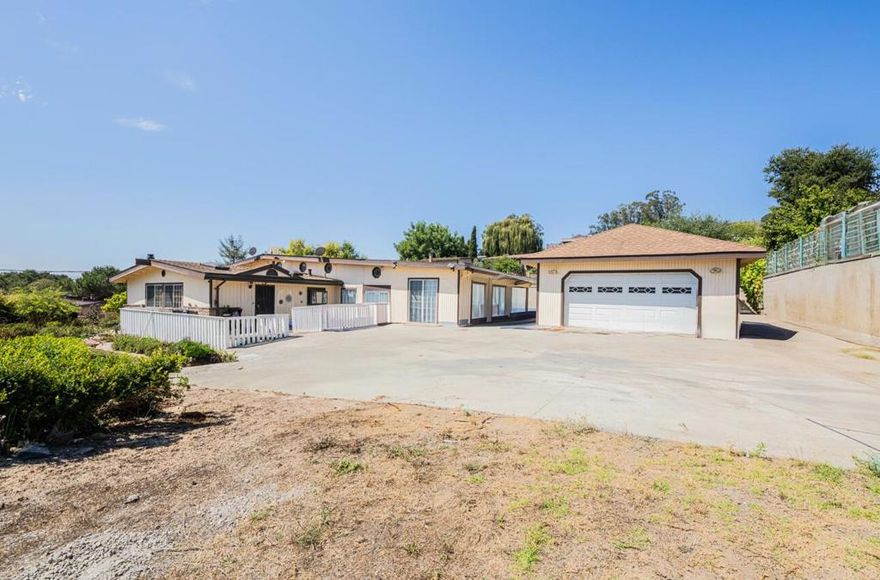 Welcome to this spacious 4-bedroom, 3-bathroom home located in the rolling hills of Prunedale. Situated on a sprawling 1.00 acre lot this property offers ample space & privacy. The land is tiered with the 3,275 sq.ft. home nestled on the lower level which boasts a detached 4 car garage, a fenced front yard & additional parking. On the upper level, enjoying 360-degree views & abundant sunshine, sits a huge orchard with many mature, fruit bearing trees. Various outbuildings offer ample storage for tools & tractors. Pickle & preserve your bountiful fruit & vegetable harvest, bottle homemade wine & store everything on shelves in the root/wine cellar. A large, commercial style, natural gas stove plus ample storage & pantry cabinets make this the perfect kitchen for the foodie who loves to cook what they grow! When it comes to entertaining, the house offers plenty of room for large gatherings & extended family. The living spaces include a formal dining room, separate family room & oversized living room with French doors leading to an outdoor area complete with a cooking and prep sink area plus a full bathroom. The floor plan lends itself to the creation of separate in-law quarters with separate entrance. Additional amenities include solar (owned) a washer& dryer & SS refrigerator.