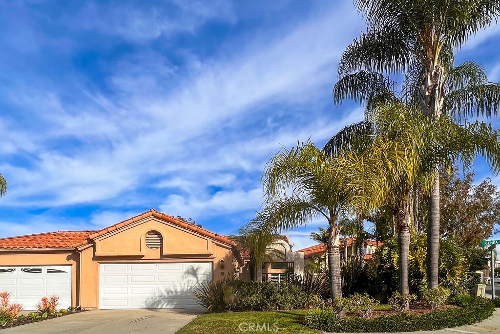 Available September 1st! This single level home is a 2 bedroom, 2 bathroom house in Marina Hills. It includes a large wrap around yard from the front to back with a wonderful patio area. Upon entering the home, the second bedroom and main bathroom are on the left. A large laundry room includes a washer and dryer. Continuing through the entryway the large kitchen is to the right, that includes corner windows for lots of light, and an area for a kitchen table. The dining and living room are an open floorplan design with high ceilings and windows and plantation shutters. A large sliding glass door in the living room leads you outside to the serene back patio and yard. The primary bedroom is situated at the back of the home with access to the patio and yard through a second sliding glass door. The primary en-suite includes a double vanity, large shower, separate water closet, and a walk-in closet. This home boasts gorgeous wood flooring and detailed wood trim and baseboards throughout. A two car garage and a driveway offer generous space for parking. This home is well maintained and recently re-piped. The amazing community of Marina Hills includes a huge community pool, spa, parks, tennis courts, nature trails and is close to the beach, shopping and freeways. Gardener included.