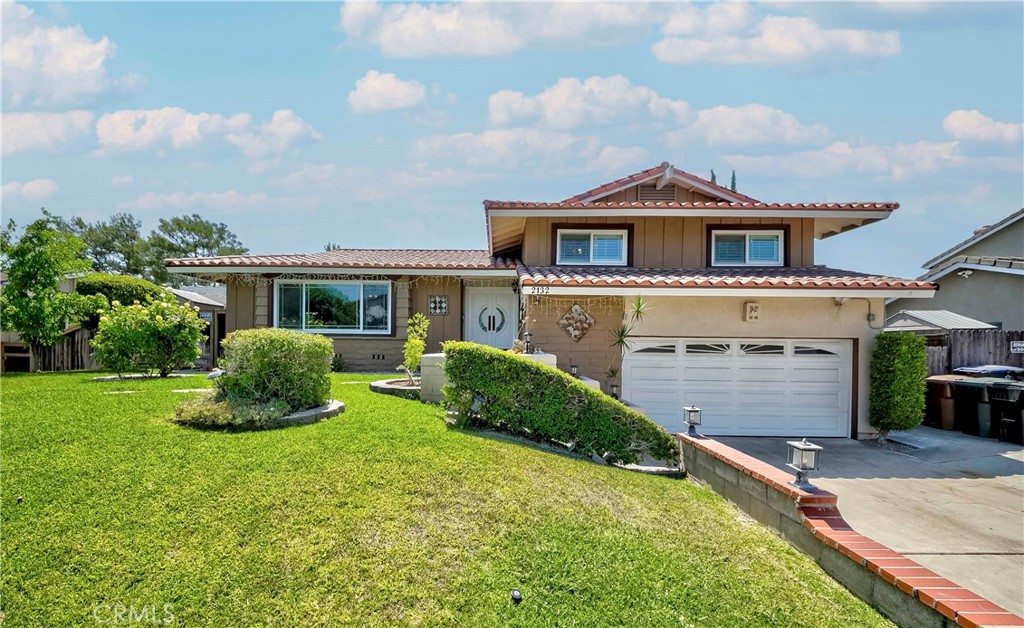 Welcome to this beautiful renovated tri-level home located in one of West Fullerton's most desirable neighborhoods within Sunny Hills District. Lovingly maintained and upgraded, this spacious home offers approximately 2,400 sq. ft. of bright, open living space with 3 bedrooms, 2.5 bathrooms, and a versatile bonus room connected to the primary bedroom-perfect as a retreat, office, or den-with stunning city light views and even Disneyland Fireworks!!! The entryway leads to a big living room that flows seamlessly into the formal dining area, which connects to a well-appointed kitchen and convenient laundry room. Recessed lighting, double-pane windows, and an airy floor plan enhance the home's welcoming atmosphere. The professionally landscaped backyard provides a serene setting for entertaining or relaxing, featuring a private swimming pool ideal for enjoying all season with friends and family. You'll also find a variety of mature fruit trees, including apple, lemon, fig, persimmon, and jujube. Additional highlights include a large family room with a upgrade fireplace, a guest half bath, a covered patio, and an attached 2 car garage equipped with an EV charger. Located just a minutes from parks, golf courses, shopping, dining, and top-rated award -winning schools-SUNSET LANE ELEMENTARY, PARKS JR.HIGH, AND SUNNY HILLS HIGH-This home truly offers the best comfort, convenience. Don't miss the rare opportunity to own a peaceful, private gem in one of Fullerton's most exclusive neighborhoods.