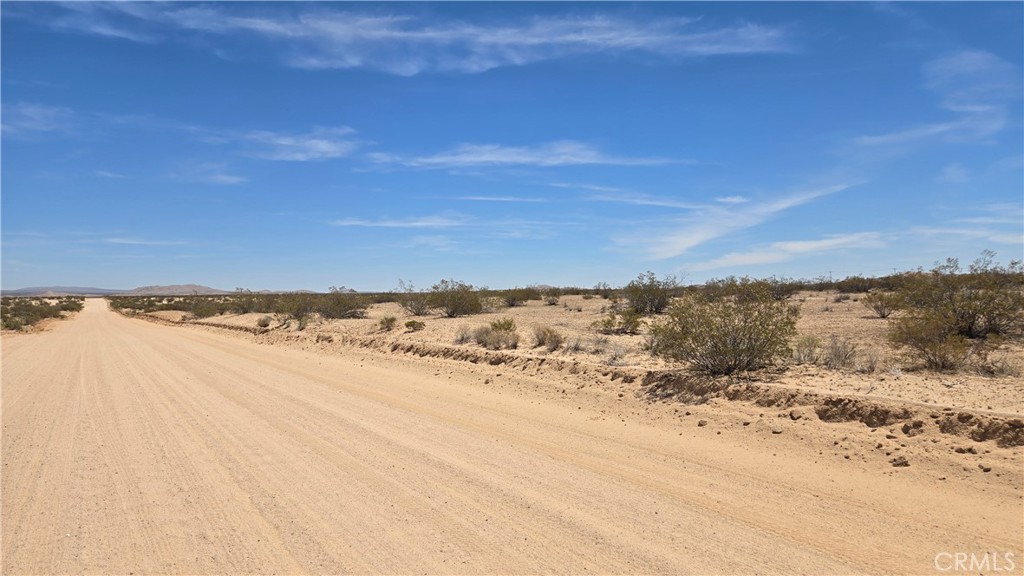 Massive 78.69± Acre parcel within the city limits of California City! This expansive, mostly-level acreage offers scenic views just a few miles from town. Convenient access via Randsburg Mojave Rd, which runs through the parcel, makes it easily reachable. Zoned for Open Space, Residential, and Agricultural use, the parcel is Industrial adjacent, which may present additional opportunities. Electricity is less than 1,000 feet away from the SE corner at 20 Mule Team Pkwy. This area is popular with outdoor enthusiasts because of the many OHV trails in the surrounding BLM lands and offers a lot of potential in the path of progress! *Buyer to make their own independent investigations regarding Zoning & General Plan Designations, Environmental & Hazard Zones, Access & Development Costs, Availability & Costs of Utilities.