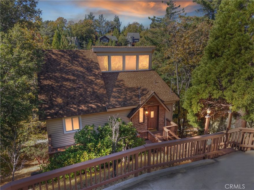 Welcome to this beautifully cared-for Lake Arrowhead home that truly shows pride of ownership. With lake rights, level parking and just ten stairs to the front door, this is the perfect mountain retreat for all seasons. Located on a county-maintained and plowed road for easy access year-round. Step inside to a warm and inviting living room featuring a stone wood-burning fireplace and skylights that fill the space with natural light. The formal dining room, well-equipped kitchen, and deck on the main level make it easy to entertain or simply relax while surrounded by nature. You’ll love the artistic touches throughout like the half bath with vintage wallpaper, gorgeous stained glass at the front door, and retro light fixtures that add charm and character. Downstairs, the primary suite offers a peaceful retreat with its own private deck and full en suite bath. Two additional bedrooms and another full bathroom on this level provide plenty of space for everyone. Recent updates include a new forced-air heater, new wood blinds, updated faucets, toilets, and light fixtures, a newer water heater, and a new retaining wall and exterior stairs all along the side of the house. Don’t let this opportunity pass you by.