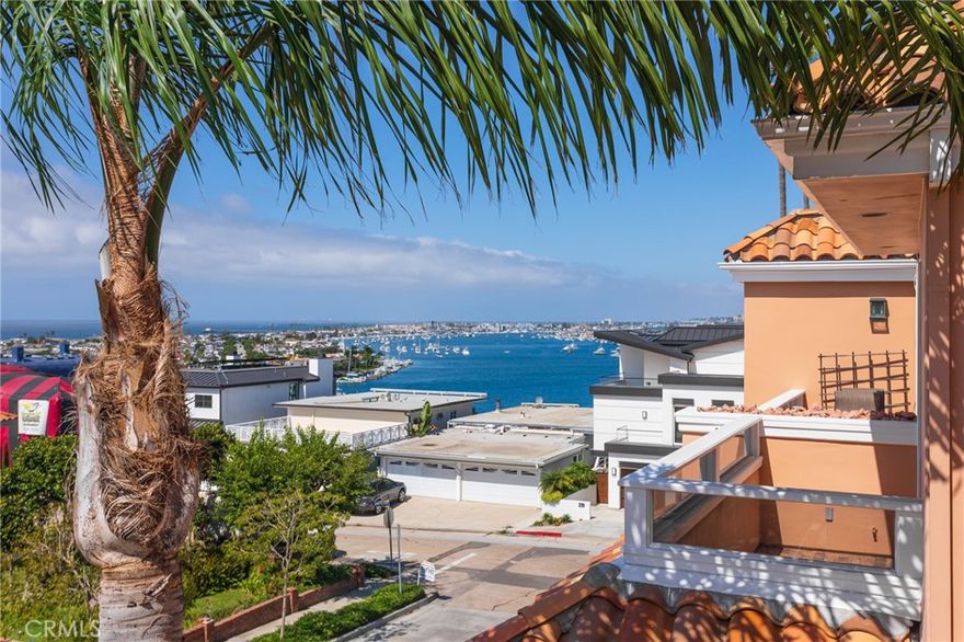 Enjoy sweeping views of Newport Harbor and breathtaking ocean sunsets from this elegant tri-level townhome—designed for those who value comfort, privacy, and effortless living by the sea. This newly renovated home offers 2 bedrooms, 2.5 baths in over 1500 sq ft of well thought out design. On the upper level, the kitchen and dining area flow to the great room. With vaulted ceilings, natural light and a contemporary fireplace, the great room opens to the balcony where indoor and outdoor living flow seamlessly together—perfect for enjoying evening breezes, expansive views and golden coastal sunsets. The chef’s kitchen is equipped with granite countertops, top-of-the-line stainless steel appliances, and custom cabinetry—ideal for both everyday living and entertaining. On the middle level, the primary suite offers a serene escape with its own private balcony, spa-like ensuite and generous closet space. The second bedroom also enjoys an ensuite bath. The private garage provides tandem two-car enclosed parking plus driveway; EV plug-in; ample space for a golf cart, work area or storage; and, laundry with washer and dryer. Located just a short stroll from China Cove Beach, Corona del Mar State Beach and shops and dining of the Corona del Mar village, this home offers a walkable, low-maintenance lifestyle in one of Southern California’s most sought-after neighborhoods. Rarely does a property combine views, location, tranquility with great design at such an attractive lease opportunity.