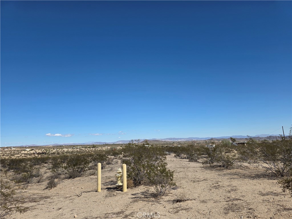 On the CORNER of PAVED Aberdeen Dr sit this 4.2 acre property ready for you to build your desert oasis! Just a short drive to amenities. Beautiful desert landscape surrounds this property, no matter the direction you look. Fire hydrant on the property and power poles along the street.
