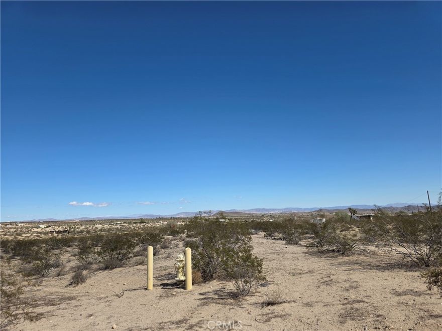 On the CORNER of PAVED Aberdeen Dr sit this 4.2 acre property ready for you to build your desert oasis! Just a short drive to amenities. Beautiful desert landscape surrounds this property, no matter the direction you look. Fire hydrant on the property and power poles along the street.