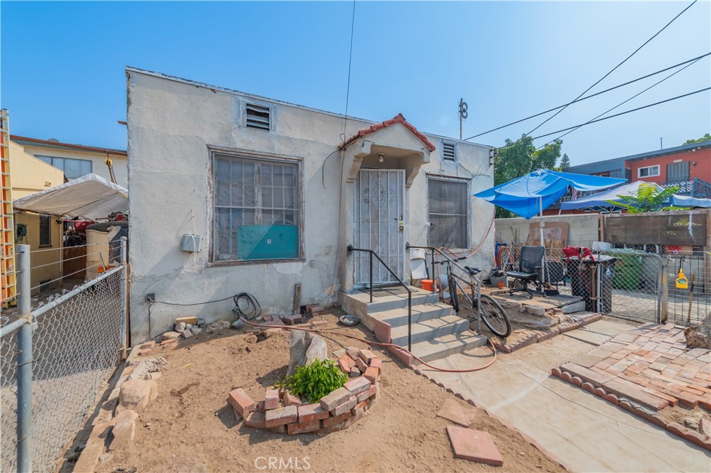 First time on the market! Located in the desirable Madison West Park neighborhood of East Hollywood, near Silverlake. This 2 bed / 1 bath home sits on a 2,002 SF lot and offers 667 SF of living space. The property is a true fixer and will require repairs—perfect for investors or developers looking for a value-add opportunity.
Zoned for multi-family, this parcel allows for the development of up to 3 residential income units. The seller prefers to sell this home as part of a three-parcel bundle with adjacent properties at 500 N Madison Ave (3 bed / 2 bath / 1,301 SF / 3,000 SF lot) and 3877 Middlebury St (1 bed / 1 bath / 805 SF / 2,502 SF lot).
Together, the three parcels total 7,504 SF of land and offer the potential to develop 9 units by right or up to 17 units with a low-income housing set-up. Ideal for seasoned investors or developers seeking a rare assemblage in a strong rental market. Total asking price for all three parcels: $1,477,000.
