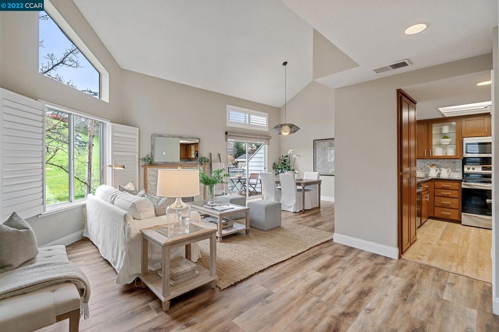 Beautifully updated end unit in the highly desirable Montecito Community on the border of Walnut Creek and Lafayette! Light and spacious with high ceilings, modern finishes, and views of the rolling hills through large windows. Plantation shutters and custom blinds elevate the experience. Recent updates include new flooring, fresh paint, newer HVAC system, electrical vehicle outlet in the garage, remodeled bathrooms, and an updated kitchen with marble backsplash and stainless steel appliances. The large primary bedroom features a fireplace for cozy nights, and the ensuite bathroom with dual sinks has a large walk-in closet with custom organizers. The second bedroom has an updated bathroom conveniently located right next to it. A flex space off the deck is finished with electrical, new flooring, and paint - perfect for zoom calls, craft projects, or a peloton. Close to highways, downtown WC/Lafayette, BART, and highly rated schools. Please visit https://www.1743ticevalleyblvd.com/mls
