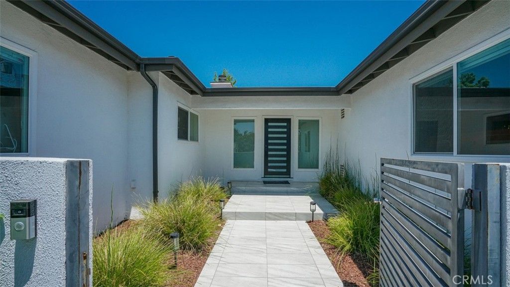 Photo of 23853 Hatteras Street St, Woodland Hills, CA 91367 (MLS # BB25208006)