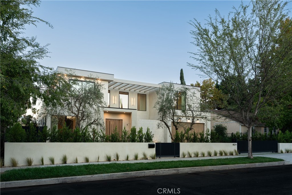 Welcome to 4824 Calhoun Ave — a stunning custom Adobe Contemporary estate nestled in the heart of Sherman Oaks. This newly constructed 5-bedroom, 5.5-bathroom home with a private movie theater redefines modern luxury with an organic, high-design aesthetic and family functionality. Spanning 5,050 square feet on a rare 10,263 square foot lot, every inch of this residence has been thoughtfully curated with sophistication, warmth, and smart living in mind.
Step inside to soaring ceilings, beautifully textured smooth plaster walls and ceilings, and wide-plank oak flooring that set a tone of serene refinement. The home is fully outfitted with Control4 smart home automation, delivering seamless control of lighting, climate, security, and a whole-home surround sound system.
The custom European kitchen is a showstopper, featuring Fisher & Paykel appliances, natural stone countertops, open wood shelving, and stunning pendant lighting — all designed to elevate daily living and entertaining. The kitchen opens effortlessly to an expansive living and dining area that flows outdoors through oversized sliding glass doors, creating true indoor-outdoor living.
The spacious movie theater room offers the ultimate in at-home entertainment, while each bedroom features its own en-suite bath and curated finishes. The primary suite includes a private terrace, spa-like bathroom, and large walk-in closet.
Outdoors, the large backyard is an entertainer’s dream, complete with a lush lawn, sparkling pool, and covered patio for al fresco lounging or dining. Perfect for families seeking space to grow, play, and enjoy, this home is located just walking distance to Trader Joe’s, Westfield Fashion Square, coffee shops, and more.
A rare opportunity to own a high-end home with luxury finishes in one of LA’s most desirable neighborhoods — blending style, space, and smart living in one unforgettable package.