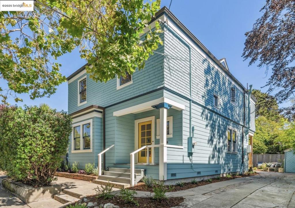 Welcome to this romantic 4-bedroom, 2-bathroom American Foursquare on a tree-lined street in the heart of North Berkeley, just moments from parks and popular shops. Built in 1903, the Foursquare style was a reaction to the more ornate Victorian, with a simpler floor plan, and an Arts and Crafts naturalistic style. From the moment you step onto the front porch, you'll be captivated by the artistic details such as the elegant cornices topping the columns and the diamond patterned leaded glass windows. Inside, discover a formal dining room with coved ceilings and brick fireplace, and both a family room, and a front parlor. The staircase in the entry graciously leads you to the bedrooms upstairs. There are warm, inviting fir floors that flow throughout. With a bathroom on each floor, and each sporting a classic clawfoot tub, comfort is assured. The kitchen seamlessly extends to a newly constructed backyard covered deck, overlooking a whimsical private garden with a glorious lemon tree. With 4 bedrooms upstairs, there is ample room for everyone. An added bonus awaits at the top of the stairs: a ladder in the hallway leads to a pleasantly surprising attic loft space, offering a bird's eye view of the neighborhood and distant hills. An inviting home awaits you at 1810 Virginia St!