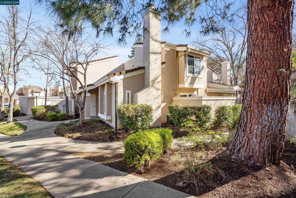 Welcome to your new home! Discover the perfect blend of privacy and convenience in this beautiful townhome, just minutes from historic downtown Pleasanton. This home features a bedroom and full bathroom on the main floor, a large upstairs primary suite that serves as a peaceful retreat, and a cozy living room with a gas-burning fireplace. Vaulted ceilings on both levels enhance the sense of space and light, creating an airy and inviting atmosphere. Step outside to your private enclosed patio—the ideal spot to relax and unwind after a busy day. Enjoy the serene ambiance of this quiet complex, complete with a community pool, a one-car garage, and guest parking. Conveniently located near award-winning schools, shopping, and freeway access, this home truly has it all.
