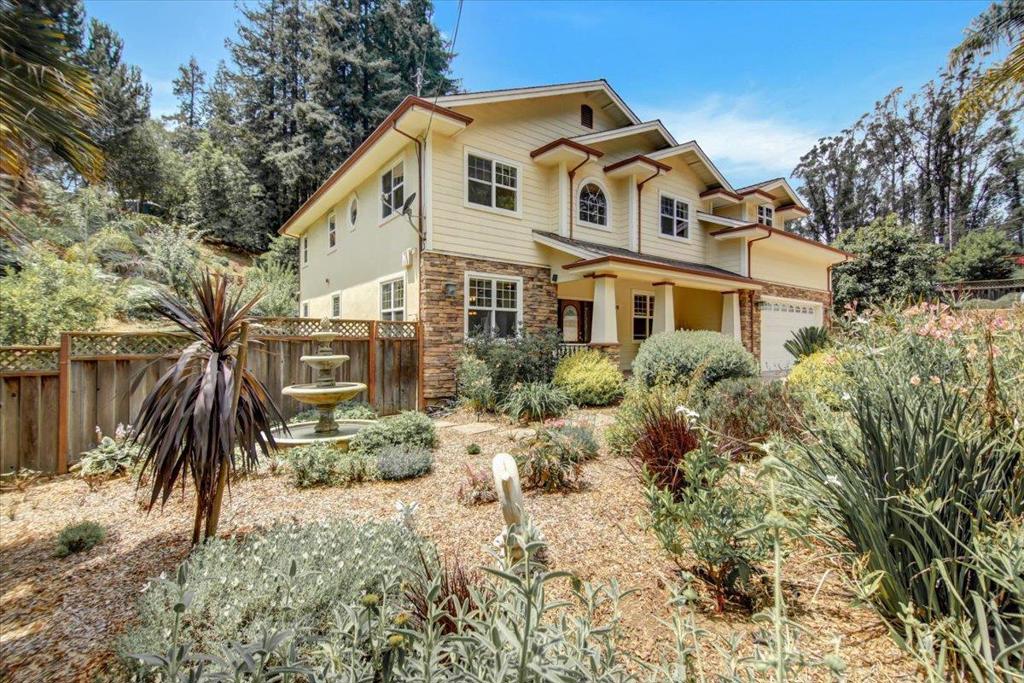 You're going to love this custom country Craftsman home with a 7 minute drive to Hwy 1, without all the work of owning a home in the country. Custom made Mahogany cabinetry throughout the home, with granite countertops in the kitchen. The chef's kitchen includes dual dishwashers and an open kitchen. There's a limestone entryway surrounded by the beautiful Brazilian Cherrywood flooring. There are high ceilings, and a ground floor bedroom and bath too. The home is wired for sound and intercom provide music and easy communication. 2X6 construction creates a sound and energy efficient home. It has solar panels to keep your electric bill low, and exterior siding that is pest, fire and weather resistant. The spacious outdoor living area includes a terraced yard with many fruiting trees, and a cathedral of redwoods. There are horse facilities should you want to ride, with many hiking/riding trails, a few doors away. This home features a backup generator system too. Nice WFH setting.