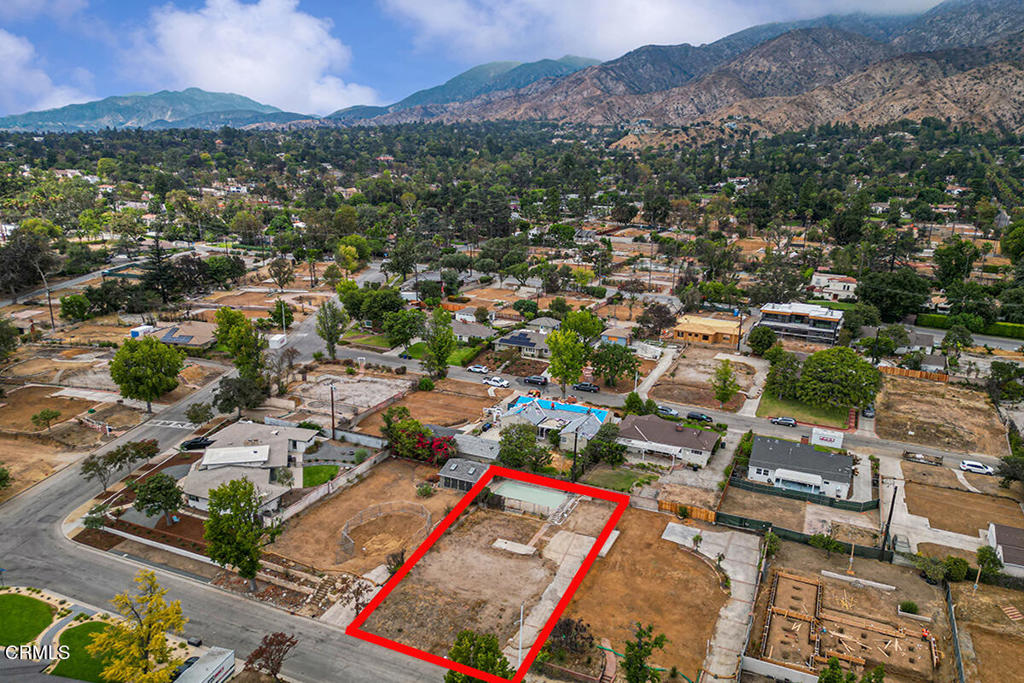 Nestled in the beautiful Altadena foothills near the Altadena Town & Country Club, this spacious 7,828 square foot south-facing flat lot with a pool is ready for your vision. With plenty of usable space, you'll have the freedom to create the home that fits your lifestyle, whether it's a classic California bungalow, a modern design, or a warm ranch-style retreat. Imagine adding gardens, outdoor living areas, or the perfect backyard for gatherings and relaxation. This premier Altadena lot is located adjacent to the estate neighborhood on the east side of the golf course. The neighborhood is largely intact and most of the homes on this street survived the Eaton Fire. The original home on this lot measured 1,406 SF, per assessor records.