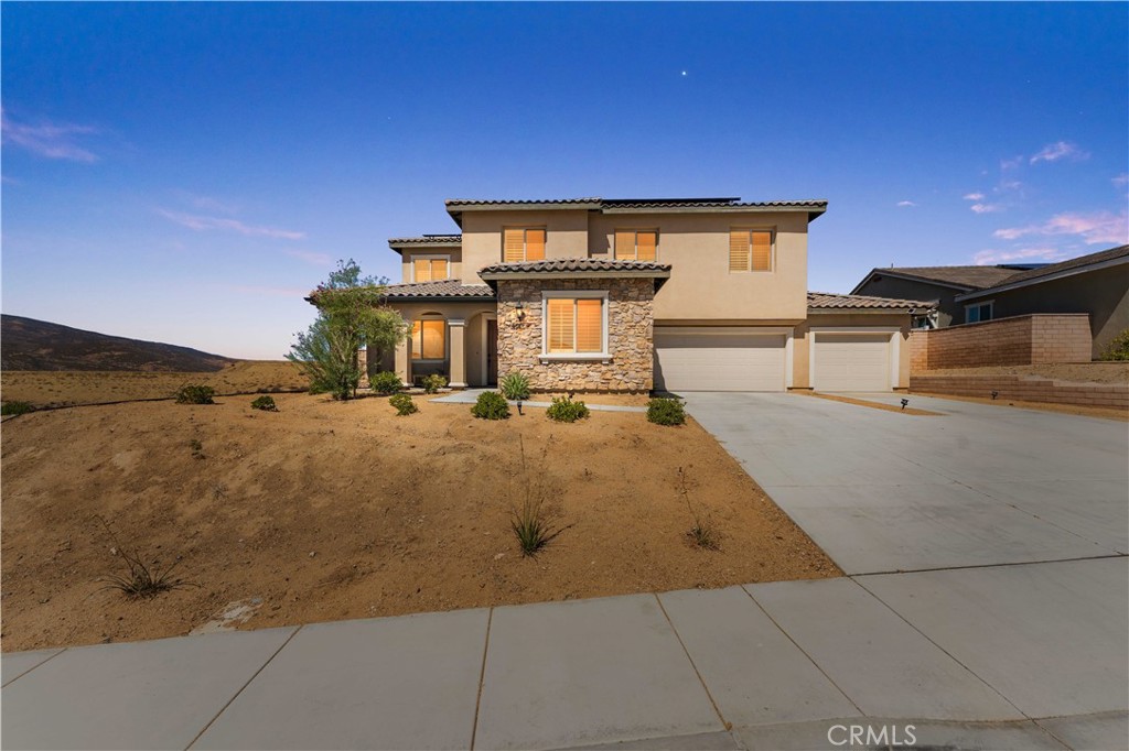 **LUXURY WESTSIDE HOME IN GATED COMMUNITY W/PAID OFF SOLAR**
Welcome to Joshua Ranch, where modern luxury meets timeless elegance. This beautifully upgraded residence offers breathtaking mountain views, a spacious backyard, and fully paid 15-panel solar system for maximum energy efficiency. Step inside to find a refined open-concept layout, with a formal dining room and designer details abound, including plantation shutters and high-end finishes throughout. The gourmet kitchen is a true showpiece, featuring crisp white cabinetry, stainless steel appliances, granite countertops, a massive center island with bar seating, a walk-in pantry, and a butler’s pantry—perfect for entertaining and everyday living. The adjoining family room, anchored by a sleek contemporary fireplace, creates the perfect atmosphere for gatherings or cozy evenings in. A versatile downstairs bedroom with a private full bath offers comfort and convenience for guests or multigenerational living. Upstairs, a spacious loft provides endless possibilities—whether a media lounge, playroom, or home office. The luxurious primary suite is a private retreat, complete with dual vanities, a stone-tiled shower, a therapy soaking tub, and a generous walk-in closet. Two additional bedrooms and a thoughtfully designed laundry room with storage and folding space complete the upper level. Step outside to ?the backyard, an open canvas with a covered patio, and panoramic mountain views—ideal for both relaxation and entertaining. A 3-car garage with EV charging adds modern convenience to this exceptional home. Blending elegance, comfort, and sustainability, this West Side gem is truly a must-see!
