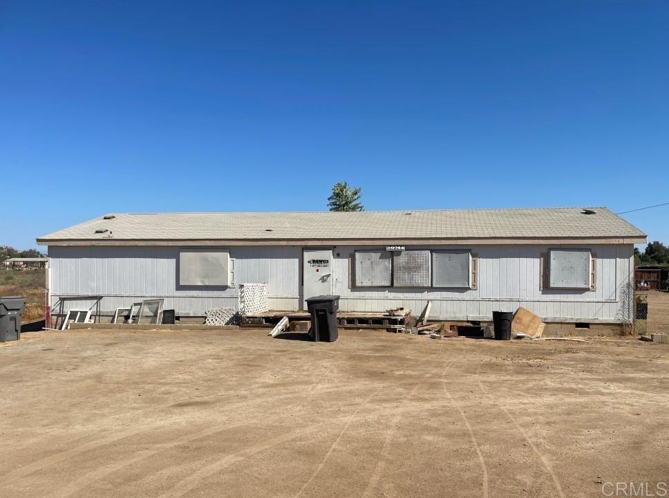 Spacious 3-bedroom, 2-bath manufactured home on a flat 4-acre parcel in Perris! This property offers endless potential for horses, agriculture, or building your dream estate. Perris is a growing community with convenient access to the I-215 and close to Lake Perris, where you can enjoy boating, fishing, and outdoor recreation. With ample space and a prime location, this property is perfect for those seeking both privacy and opportunity.
