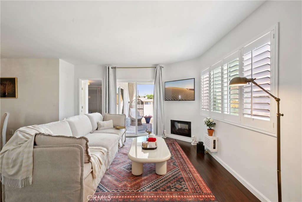 Cozy Redondo Beach Condo in Prime South Bay Location
Welcome to 2704 Voorhees Ave #4, Redondo Beach
Located in a quiet 4-unit complex in the heart of Redondo Beach, this spacious and charming 1-bedroom, 1-bathroom condo offers 795 sq ft of comfortable living. With an open-concept layout, beamed ceilings, and an electric fireplace, the living area exudes warmth and character. Step out onto the oversized private balcony—perfect for enjoying the coastal breeze or relaxing with a cup of coffee.
The kitchen features granite countertops, ample cabinetry, and lightly used appliances including a refrigerator, built-in microwave, and electric range/oven. The generously sized bedroom includes a large closet with built-in shelving, while the full bathroom is filled with natural light thanks to a skylight and features tasteful updates.
Additional highlights include a private 1-car garage with laundry and shelving, plus an assigned parking space and a locking storage closet. Conveniently located near the beach, major freeways (405/105), shopping, and restaurants—this move-in ready condo is the perfect opportunity to enjoy the relaxed South Bay lifestyle.