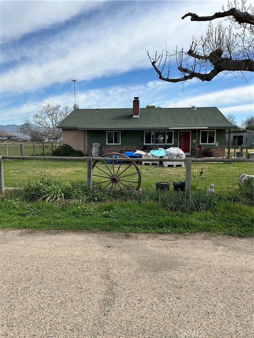 Rare 2 acre parcel with 3 bedroom 2 bath home. Completely updated 11 years ago including new roof. Separate building with many uses. Chicken coops and fencing for animals.