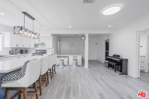 Photo of 1032 4th Avenue, Los Angeles, CA 90019 (MLS # 26991239)