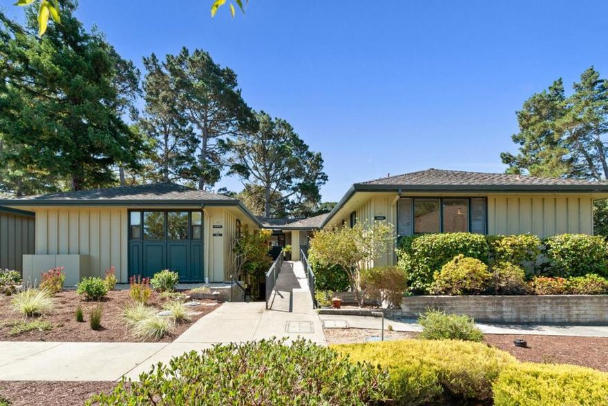 Perched in a breathtaking location with panoramic views of the Pacific Ocean, Pt. Lobos, the Santa Lucia Mountains, and a serene, forested canyon, this light-filled, stylish home is an entertainers dream. This beautifully updated home exemplifies the best of Carmel Valley living in the area's premier active adult community.  Floor-to-ceiling windows frame spectacular views in the living room area, complemented by a gas fireplace with live-edge wood mantle and stone surround. The open concept living and dining area flows into a cozy den/library with retro wet bar for added charm. The gourmet kitchen features granite countertops, step in pantry, ample cabinetry, counter space, and in-unit laundry with upgraded tankless water heater. Bathrooms are exquisitely remodeled to offer a spa-like experience, with curbless, floor-to-ceiling tiled showers, rain heads, handheld wands, and frameless glass doors. Radiant heated floors ensure year-round comfort throughout the Model F unit.  Del Mesa Carmel is a premier 55+ gated community with a clubhouse, gourmet restaurant, library, indoor pool/spa, fitness center, putting green, lawn bowling, garden plots, walking trails, vibrant events, and beautifully maintained grounds.