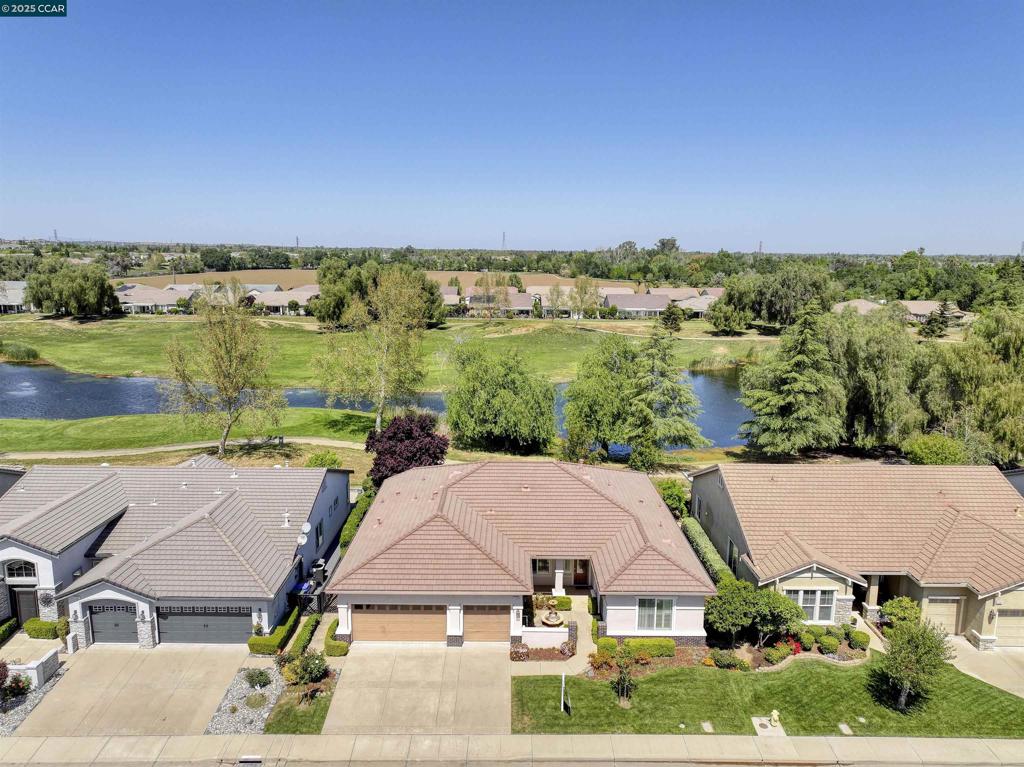 PRICE REDUCED! Gorgeous spacious single story home with stunning golf course and water views. Sought after Magnolia model features a bright open floor plan with soaring ceilings and lots of natural light. Features great room and a formal dining room. Large kitchen features stainless steel appliances, bar seating, a walk-in pantry and a cozy breakfast nook. Huge primary suite features soaring ceilings, with stunning views of golf course and water. Primary bathroom features an oversized walk-in shower, a separate tub, double sinks and a huge walk-in closet. Guest suite features gorgeous views, large private bathroom and walk-in closet. Third bedroom/den has private entrance (french doors at courtyard) and features custom wainscotting. Large laundry room. Gorgeous covered patio. Front courtyard. 3 car garage. Summerset 4 is a 55+ community with tons of amenities, including pool, spa, clubhouse, gym, game room, billiards, library, ballroom, tennis and bocce ball. Conveniently located near shopping, restaurants, golf courses, parks, highway 4.