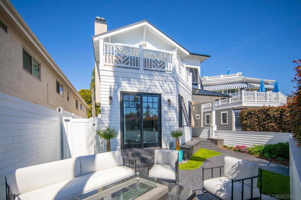 OCEAN VIEWS, WALK TO BEACH AND TOWN, NEWER CONSTRUCTION! Located in the most idyllic and central location in Coronado, this is 4200 square feet of absolute perfection! Designed with exceptional detail & style featuring 4 gorgeous bedroom suites, 7 bathrooms (yes, 7), with Family room & full bar and game room! Epic reverse floor plan design allows for Ocean views on 2 levels. Open great room featuring chef's kitchen w/large center island, high-end appliances, all opening to living & dining. Roof deck is the perfect gathering place for evening sunsets & happy hour! Fire pit, wet bar in lower level, garage, 2 washers / 2 dryers, ping pong table, outdoor kitchen, elevator to all levels (including rooftop access), the list is endless! Enter the main level in the expansive foyer area and 2 private en suite bedrooms. Upstairs encompasses a large kitchen/dining/living great room, complete with marble fireplace, doors out to deck (with ocean views), and a second junior master suite. The kitchen is spectacular with soapstone countertops, large center island, butlers pantry, wine refrigerator and top of the line appliances. Continue upstairs to the 3rd floor rooftop deck with marble and stainless outdoor kitchen, powder room, lounge chairs and patio dining table. Watch the waves and enjoy the sunset! The lower level has a wet bar and den, a bedroom and bathroom, along with the ping pong table! This is the perfect getaway for kids and/or guests to have their own space! Amazing home and prime village / beach location!