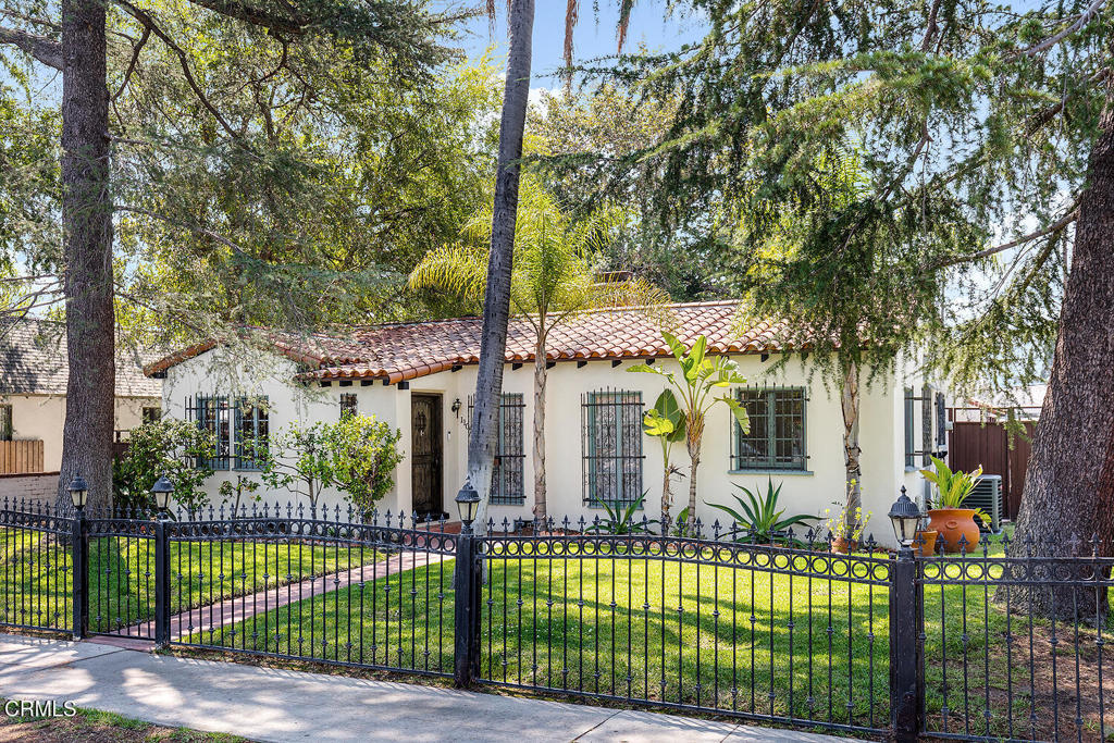 Welcome to this spacious and stylish Spanish-inspired home for lease, set on a large gated corner lot of nearly 9,800 sq ft. With 1,564 sq ft of living space, this 2-bedroom, 1-bath home offers charm, thoughtful updates, and room to live, work, and play - all just minutes from the North Hollywood Metro station and the vibrant Arts District's restaurants, bars, and creative energy.Inside, you'll find a formal living room with beamed ceilings, a decorative fireplace, and cabinets for storage and display. A separate, oversized den features a media center, bar area, and flexible space that's perfect for a playroom, dining space, or home office.The formal dining room includes a built-in corner cabinet, and the adjacent kitchen features a large pantry, stackable washer and dryer, and direct access to the den for easy entertaining.Both bedrooms are private and well-sized, with generous closets (including shelving and organizing units) The rear bedroom opens directly to the backyard through French doors.Step outside to your own private retreat: a huge backyard with a pool (with retractable cover), grassy lawn, and multiple inviting areas for lounging, dining, and entertaining. A detached bonus studio adds even more flexibility--perfect for a home office, art space, or creative hideaway.Additional features: central air and heat, pool and gardening services included, two driveway parking spaces included. Tenants to pay utilities. 14 month lease term. Furniture and appliances included (negotiable). Pets accepted upon review, with a pet deposit. This is a rare opportunity to lease a truly special home with character, space, and amenities that are hard to find.