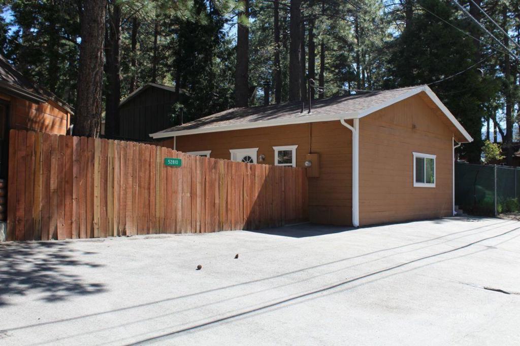 Here is two homes on a corner lot. 1st home is a 1 bedroom 1 bath with wood stove, propane heat, remodeled in 2017 with knotty pine ceilings and recess lighting. Private fenced yard and ample parking. The second unit is a studio unit with a full bath and a new kitchen in 2017. Cute and always full making $$ for the investor. Maintained street and ample parking. Tenants pay their own metered Edison electric, and each unit has its own Propane tank. Each tenant reimburses 1/2 of the water base with rent. Large lot, possibly add another unit in the rear.