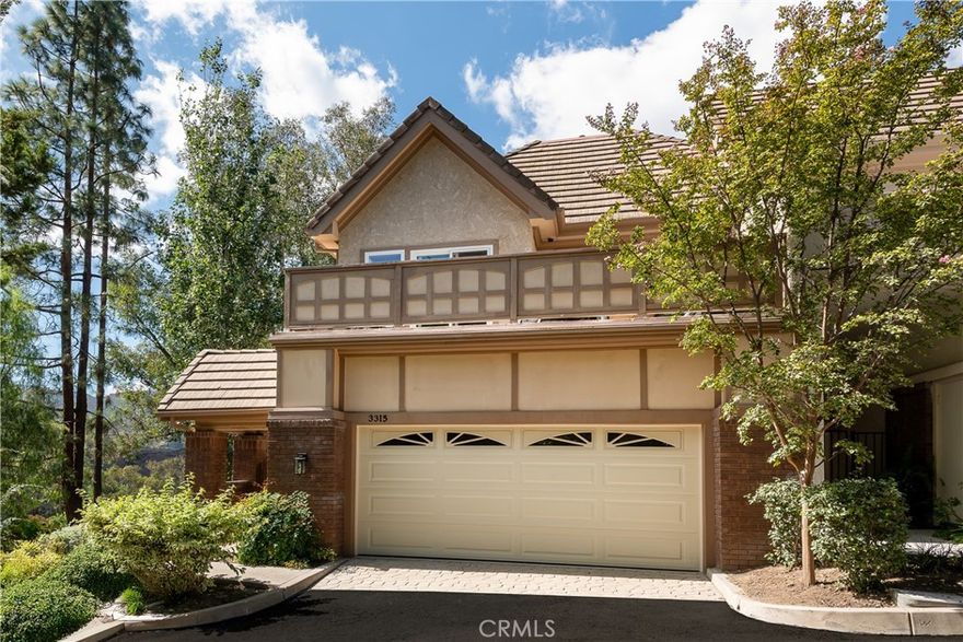 Welcome to the coveted gated community of Westlake Pointe, where this brand-new, fully reimagined residence is framed by sweeping valley and mountain vistas. This end-unit townhome blends timeless modern opulence with enduring quality, featuring vaulted ceilings with exposed wood beams where natural light pours across every corner of living space. The vast, open family room is steps away from a designer kitchen featuring quartz countertops, a standalone island, stainless steel appliances, a wine bar, and a formal dining area ideal for gatherings. The lower level offers a private en-suite bedroom or office with mountain views and a hand-laid tile shower. Upstairs, the serene primary suite boasts vaulted ceilings, a spa-inspired bath with a soaking tub, walk-in shower, two expansive closets, fireplace, and breathtaking views. Two additional spacious bedrooms open to a private deck for relaxing outdoors. Every detail has been upgraded, including sealed solid wood Mandalay Hickory engineered hardwood flooring throughout, copper plumbing, brand-new HVAC, electrical, and windows, fully waterproofed patios, and a drip irrigation landscape system. This is simply more than a renovation; this home is a complete reinvention of luxury living in Westlake Pointe.