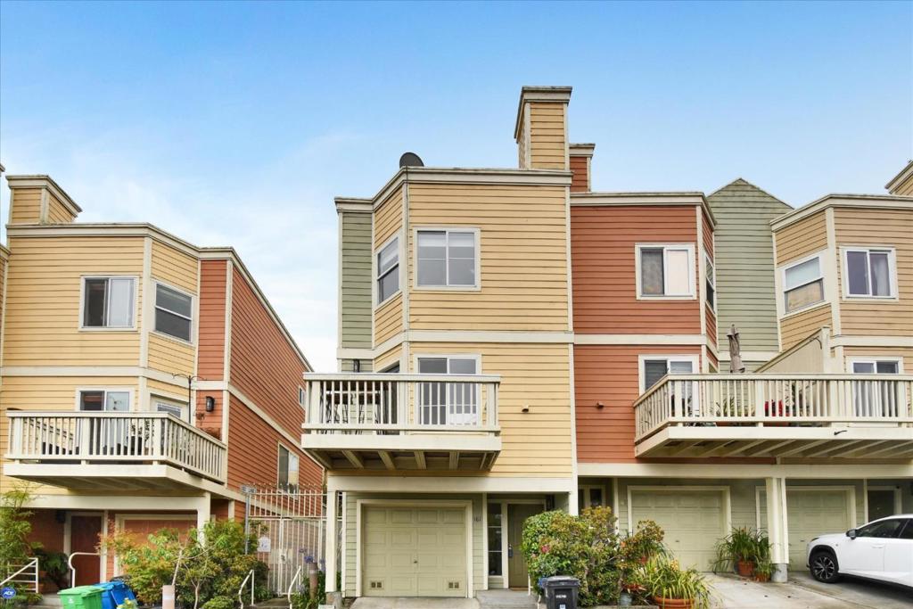 Welcome to 161 Cleo Rand Lane, a beautifully maintained three-story townhouse style condo built in 1989, offering 1,150sqft of living space with 2 bedrooms, 1.5 baths, and a 1 car garage. Enjoy private outdoor living spaces, including a deck and balcony perfect for morning coffee or evening relaxation with a bay view. Conveniently located near Herons Head Park, public transit, and an array of local shops and dining, this home delivers a perfect blend of comfort and urban accessibility.