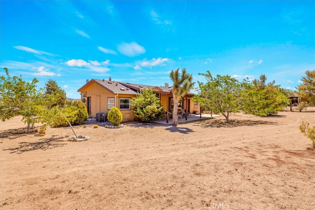 Own your own ranch right in the heart of Pioneertown! 1.26 acre horse property, just a block away from Mane Street, with a large, luxury ranch house with many upgraded features. Large covered patio in front to relax and enjoy the peace and quiet; high ceilings and oversized windows to take in the glorious views; stack rock fireplace to warm those chilly nights; spacious living room and open kitchen with bar for entertaining your guests; primary suite with walk-in closet, spa bathtub and separate shower in the roomy bathroom. Central heating and air conditioning with additional Master-Cool type swamp cooler. Indoor laundry room with included washer and dryer. Three bedrooms and two full bathrooms for a total of 1,742 square feet, all on a fenced-in and gated lot on a private cul-de-sac just a short walk to all that Pioneertown has to offer; world famous Pappy and Harriet's Restaurant, Bar and Concert Venue, Pioneer Bowl, Red Dog Saloon and more! Just a short drive through the rock covered hills to Yucca Valley, Joshua Tree and Palm Springs.
If you've been here you know how special this location is; if not you must come and see it for yourself. The village of Pioneertown was built as an authentic movie set for the western movies of the 40's and 50's and still maintains it's rustic charm. Come and see what life in the High Desert is all about and check out this rare opportunity!