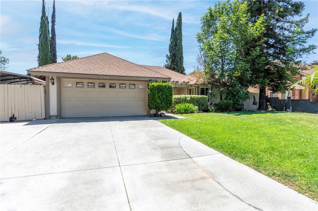 A turn-key well-maintained single-family home located in a desirable Riverside neighborhood. Built in 1978 and offering 1,595 square feet of living space, this single-story property features 3 bedrooms+Bonus Room and 2 full bathrooms on a 7,405 square foot lot, zoned R-1 with no HOA. The home includes a functional layout with a formal entry, living room, and a separate family room. The living room features a fireplace, and the tile flooring extends through the entry, kitchen, and dining area, while the rest of the home is finished with luxury vinyl or hardwood floors. The kitchen is equipped with granite countertops and tile flooring, providing a durable and practical space for daily use. Recent updates include newer windows, a gas-powered central air conditioning and heating system, and a newer roof . The attached two-car garage offers direct access, and RV parking is available on the side yard. Public water and sewer services are connected. The backyard features a private in-ground pool and hot tub, ideal for both summer and winter use, along with a sufficient usable front yard and back yard space. Pets welcomed. One side or property is currently fenced, has a chain link door and it is used as a small open kennel for the family pets. The neighborhood includes curbs, sidewalks, and street lighting, contributing to a clean and walk-able suburban environment. The roof is shake/shingle style and it offers a solid combination of functional features, lot size, and updates, making it a strong option for buyers seeking a well-located, move-in-ready home in Riverside. First time home buyers are also welcomed.