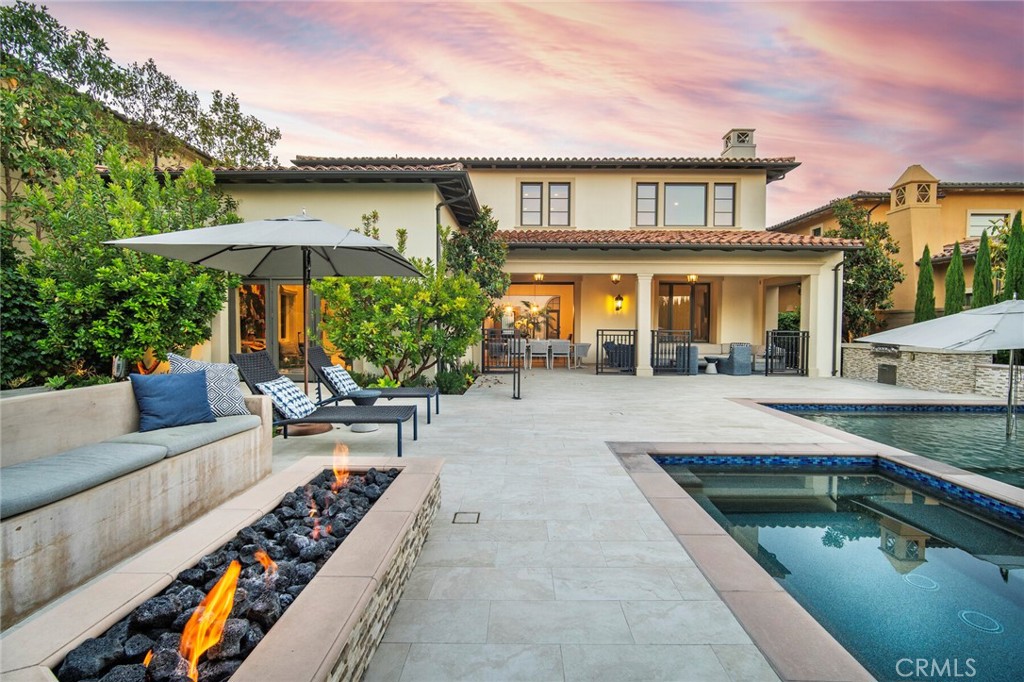 FIANO at PACIFIC RIDGE NEWPORT COAST | Welcome to 16 Seawatch, an exceptional residence located in the exclusive guard-gated community of Pacific Ridge, Newport Coast.
This highly desirable Fiano Plan 3 design offers over 5,600 square feet of living space located on one of the community’s largest 10,600 square foot plus lots. This Fiano home offers 5 bedrooms and 5.5 bathrooms, blending timeless elegance with quality craftsmanship and designer upgrades throughout.
A gated front courtyard sets the tone for this natural light-filled home, where expansive living spaces are accentuated by soaring ceilings and walls of disappearing floor-to-ceiling glass doors—seamlessly connecting the indoors to the impressive private rear grounds. The large backyard is designed for entertainment, complete with a spacious pool and spa, lounge and dining patio, built in bar-b-que, fire pit, and a turf lawn.
At the heart of the home is a gourmet chef’s kitchen featuring dual oversized center islands with bar seating, professional-grade appliances, a generous walk-in pantry, and a fully equipped prep kitchen—perfect for hosting on any scale.
The well-thought-out floor plan includes four en-suite bedrooms and a home fitness center that can repurposed as an optional bonus room on the upper level, including a luxurious primary suite, a rare configuration in Newport Coast. A fifth en-suite guest bedroom is conveniently located on the main level in addition to a separate and private in-home office. Garaging for three vehicles plus an additional storage room complete this move in ready Fiano residence.
Residents of Pacific Ridge enjoy access to active and resort-style amenities and are just minutes from pristine beaches, world-class shopping, golf, dining, and major freeways.