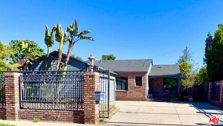 REMODELED and almost complete home nestled on a quiet cul-de-sac.  This gated residence features a newly expanded kitchen with all new appliances, beautifully refinished hardwood floors, and updated new windows throughout. All 3 bathrooms have been tastefully remodeled. Large primary ensuite with large walk in closet has double doors to yard. Enjoy a huge yard on a spacious 7,851 square foot lot. Convenient access to the 170 freeway makes commuting a breeze. No short-term rentals. Don't miss out on this beautifully updated home!