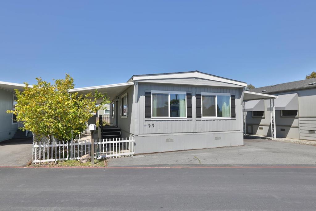 Charming, Move-In Ready Home in quiet 55+ Community! Enjoy the ease of low space rent (only $860) and no property taxes in this beautifully remodeled double-wide home, offering approximately 840 square feet of comfortable living. Featuring 2 bedrooms and 1 full bathroom, this thoughtfully updated residence has undergone a stunning renovation within the last 2 years. Step into the bright and airy galley-style kitchen, complete with stainless steel appliances, modern lighting, and fresh flooring throughout. The bathroom has been tastefully updated with a newer vanity, shower, and toilet for your comfort and convenience. Double-pane windows provide energy efficiency and a peaceful atmosphere. The spacious living room is filled with natural light. The large front porch is perfect for relaxing with a cup of your favorite beverage or visiting with friends. The backyard offers space for a garden or a small pet. Located in the desirable Wagon Wheel Mobile Home Village, a welcoming senior community for residents aged 55 and older. Enjoy the convenience of being just a short distance from excellent dining and shopping options. Just off of Highway 101 near the Leavesley Rd. exit. Restaurants and Gilroy Outlets are nearby.