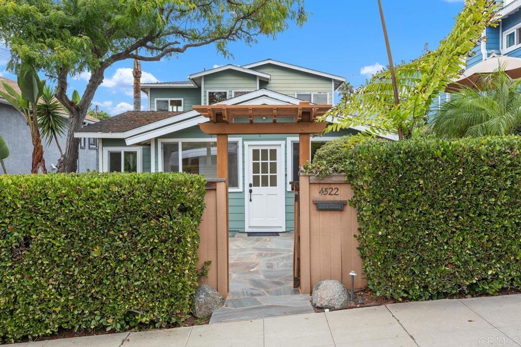 This charming 4-bedroom, 3-bathroom home offers the perfect blend of comfort, style, and coastal living. Featuring gleaming hardwood floors, an abundance of natural light, and a spacious, open floorplan with views, this home is designed for easy living and effortless entertaining. The inviting kitchen opens to the family room, which leads to a view deck—ideal for morning coffee or taking in colorful sunsets. The private primary suite is a peaceful retreat with views and a luxurious bathroom plus a versatile loft space perfect for a home office, wellness room, or cozy den. Located just a short walk to all that Ocean Beach has to offer—boutique shops, local restaurants, and the beloved farmers market—this home captures the best of beachside living.