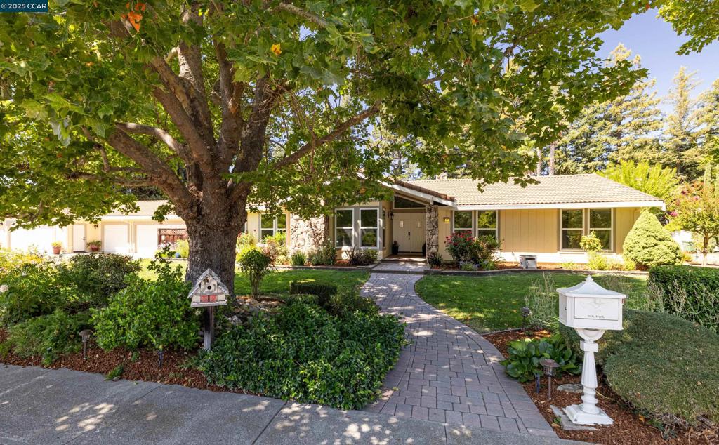 This beautifully updated single-story home offers the perfect blend of space, comfort, and convenience. A rare and valuable feature is the 5 plus-car garage, perfect for car enthusiasts, storage needs, home workshop. Featuring 4 spacious bedrooms and 2 bathrooms, this home has been freshly painted and enhanced with new lighting throughout. The single-level layout makes daily living effortless, with open spaces ideal for both relaxing and entertaining, beautiful hardwood floors throughout the main living areas complement the fresh, bright interior. The backyard boasts 2 covered metal trellises, meandering gardens and a lovely fountain, this yard is a gardeners delight. Open House Sat/Sun 1-4 Located just minutes from town, you’ll enjoy quick access to shopping and dining—while still being close to scenic walking trails for biking and long walks. Buyers will appreciate the home’s location near top-rated local schools, making it an ideal setting to grow and thrive. Whether you're starting a new chapter or looking to settle into a forever home, this property offers modern updates, practical design, and a lifestyle centered around convenience, quality, and community. A rare opportunity in a sought-after location! Open House 8.23 and 8.24 1-4PM.
