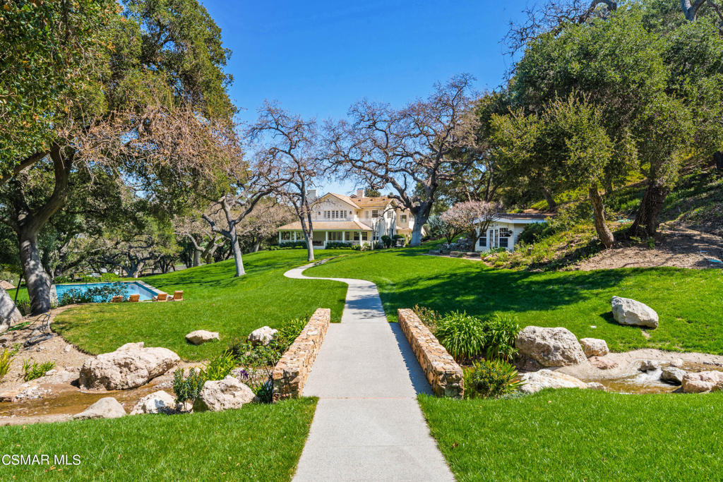Once in a lifetime an opportunity comes along and you know you have found the Extraordinary!There's a comforting aura about Brookfield Farms. You'll first sense it when you pass through the privacy gates and breathe in the clean, gentle breezes. You'll feel it as you travel down the winding driveway past shady groves and sparkling streams ringed by century-old oak trees and bordered by acres of meticulously manicured lawns. You'll know it when you experience the charming American Farmhouse architecture reminiscent of a much simpler place and time. It's that all-too-rare feeling that says, 'relax...you're finally home'. Welcome to Brookfield Farms. As if from the pages of a classic novel, lush blackberry bushes grow alongside white picket fences, and a pastoral fishing pond beckons you to while away the hours on a summer's day. Reconnect with nature on this 60-acre tapestry of some of the most spectacular land the area has to offer. Majestic and finely crafted, Brookfield Farms stands out as an exceptional estate property in exclusive Hidden Valley with endless possibilities to make it your own. Remaining aesthetically in sync with the natural beauty and quietude of its surroundings are the many facilities that service the property including staff quarters; an updated sparkling pool; horse pasture, five-car garage and gym; and gardens that produce a variety of vine-ripened fruits and vegetables for the dinner table. Additionally, you can welcome overnight guests into the three extensively renovated picturesque guest cottages offering private porches and yards.Anchoring the compound is the generous 6,720 square foot, 3 bedroom 4 bath main residence created in classic American Farmhouse style. The main floor offers a spacious Great Room ideal for gatherings, complemented by a double-height fireplace and abundant natural light streaming through the French doors that open to the deep wrap-around porch and panoramic views beyond. The kitchen, seamlessly integrated with the Great Room, a charming breakfast nook and expansive butler's pantry, promises a delightful culinary experience.Accessed by either staircase or private elevator, the Primary suite spans the width of the home and boasts luxurious amenities including private dressing rooms and baths, a cozy sitting room/library with a wood-burning fireplace, and a serene bedroom with access to a private terrace offering sweeping views of Brookfield Farms.Experience the beauty of nature and the charm of a bygone era at Brookfield Farms, where every moment is an opportunity to savor the changing seasons amidst spectacular surroundings.Ideally situated near Sherwood Country Club and Camarillo Airport, and just 45 minutes from Beverly Hills, this property offers an unrivaledlifestyle in one of Southern California's most desirable locations.