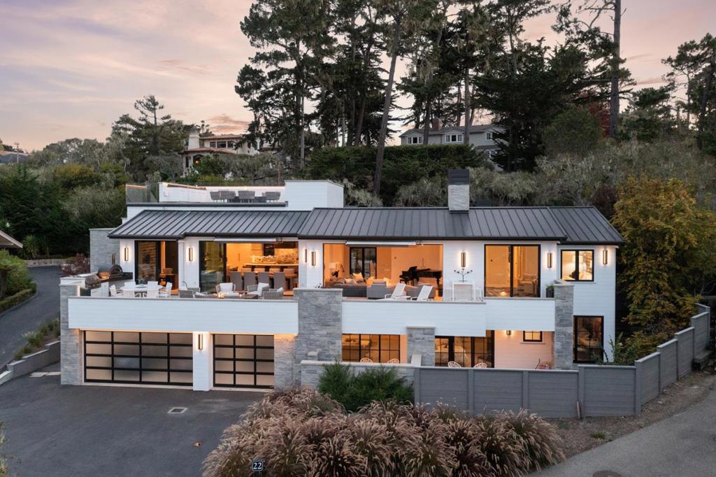 Located within the legendary Pebble Beach Resort, this incredible oceanview luxury home is a private residence just steps to all the world-class amenities at The Lodge and Beach & Tennis Club. The home has been completely remodeled to the highest quality with interior design by Jeffrey Doherty. The main level's impressive great room contains an exquisite kitchen leading into the dining area with a full bar, beer tap and wine fridge. The stylish living areas flow effortlessly through automated floor-to-ceiling glass doors to the expansive main deck with an outdoor kitchen, dining, and additional seating areas with a fire pit and industrial heaters. The main floor also includes an incredible primary suite with dual bathrooms/closets. Other highlights include almost 5,000 SqFt of modern living space, room service from the resort, a movie theater, 4 ensuite bedrooms + 2 powder rooms, an office, 5-car garage, top sound, lighting, and security systems, and a stunning rooftop view deck.
