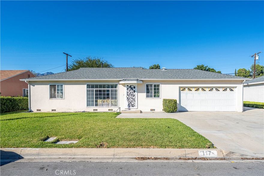 Welcome to this charming single-story home in the desirable Mayflower Village neighborhood of Monrovia where comfort, style, and everyday convenience come together beautifully. Featuring 3 spacious bedrooms and 2.5 bathrooms, this inviting residence offers a warm and functional layout designed for easy living and effortless entertaining. Step inside to a bright and welcoming living room with a large picture window, filling the space with natural light. A separate sitting area provides flexibility for a cozy reading nook, home office, or play space. The formal dining room flows seamlessly into the kitchen, which features sliding door access to the backyard perfect for indoor-outdoor dining and gatherings. Out back, you’ll find a large covered patio, ideal for weekend barbecues or evenings under the lights, along with direct access to a convenient half bathroom for guests. The 2-car attached garage with direct entry adds everyday practicality. Recent upgrades include a new AC and heating system with new ductwork, recessed lighting, and crown molding, adding both comfort and style throughout. Situated near schools, local parks, and shopping, this home offers the perfect balance of suburban tranquility and modern accessibility. Don’t miss your chance to make this delightful Monrovia home your own.