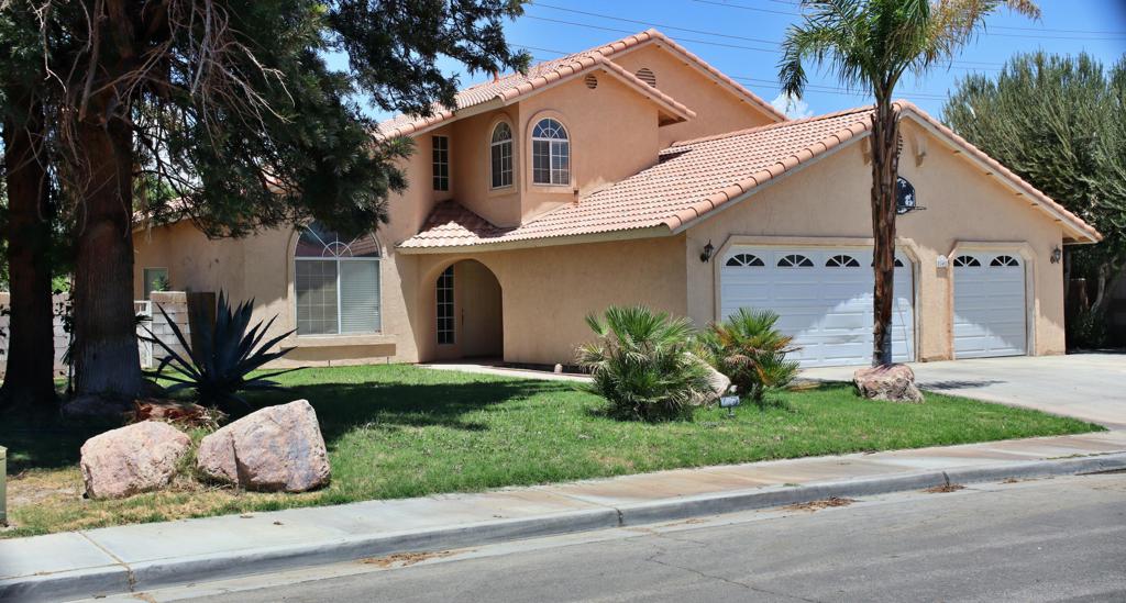 Great opportunity to own a two-story home in the city of Indio with No HOA and No Rental Restrictions. This property is perfect to call home, vacation home or as a short term rental. With TLC this home can have great potential. Home offers 2399 sq. ft. with four bedrooms two bath. Main floor has formal dining and living room, family room with cozy fireplace, breakfast nook, spacious kitchen, laundry room and two bedrooms and full bath. Spacious master bedroom with walk-in closet is located upstairs with large master bathroom that offers dual sinks, tub and separate shower. Third guest bedroom is located upstairs with walk in closet. There's also a bonus sunroom off of the family room and three car garage. Perfect location to restaurants, shopping, golf courses, and the famous Coachella Fest, Stagecoach, Polo grounds. Buyers to verify city short term rental requirements. Images are from a prior listing and may not represent the current landscaping condition. Updated photos coming soon. Buyers are advised to conduct their own due diligence regarding rental restrictions with the city of Indio.