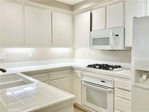 Photo of 904 Reggio Aisle, Irvine, CA 92606 (MLS # OC26034813)