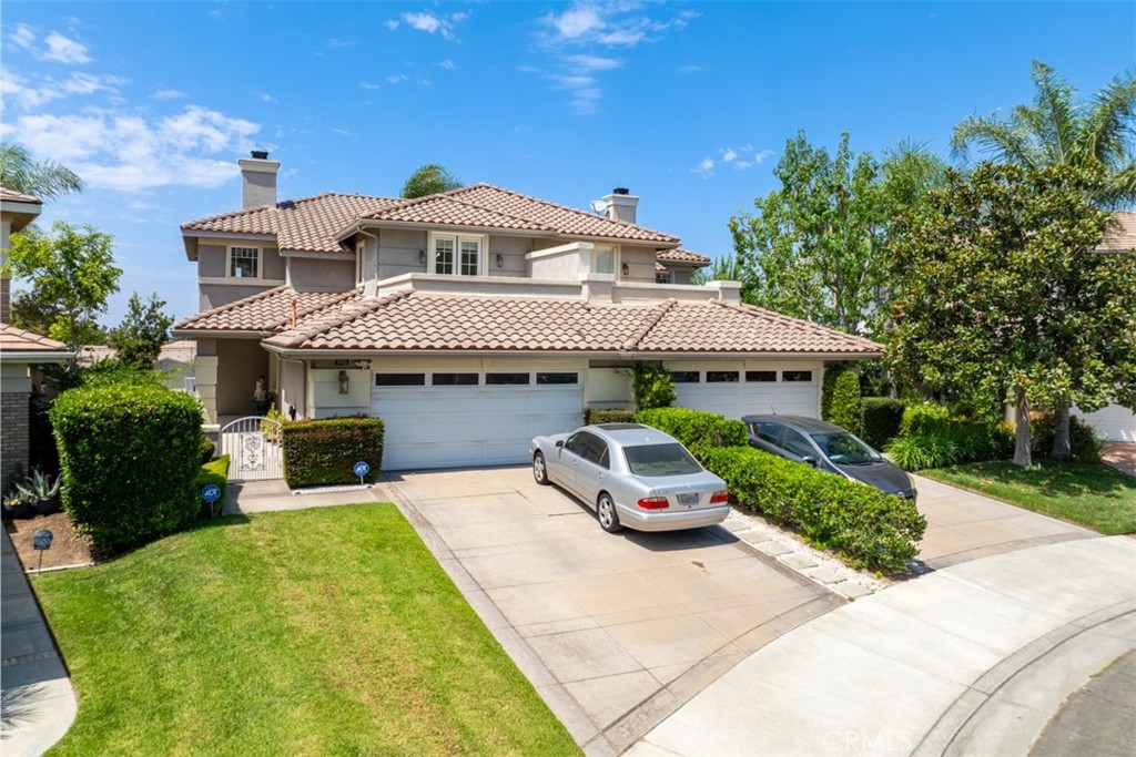 View Property Nestled on a tranquil cul de sac in coveted Anaheim Hills this beautifully maintained 3 bedroom 3 bathroom executive style home offers 2358 sq ft of living space on a spacious 5227 sq ft lot Built in 1999 and presented in move in ready condition every detail reflects pride of ownership
The grand open plan interior features soaring ceilings and a dramatic living room accentuated by a warm fireplace and stylish recessed lighting Entertain with ease in the gourmet kitchen outfitted with granite countertops a center island abundant cabinetry and under cabinet lighting A formal dining area with an adjacent bar offers added entertaining versatility
Main level living is enhanced by a convenient bedroom and full bath while upstairs dual master suites impress with vaulted ceilings walk in closets dual vanities and luxurious spa style baths Each suite features its own private balcony perfect for morning coffee or evening relaxation while showcasing stunning city light views
Outside enjoy one of the largest yards in the area ideal for entertaining gardening or simply soaking in the sunsets The home also offers a two car garage with direct access and built in storage plus an interior laundry room with sink and robust storage space
Located within the award winning Running Springs Elementary and top rated Canyon High School zones and close to El Rancho Charter Middle School this home combines luxury functionality and excellent schools making it a rare find in Anaheim Hills