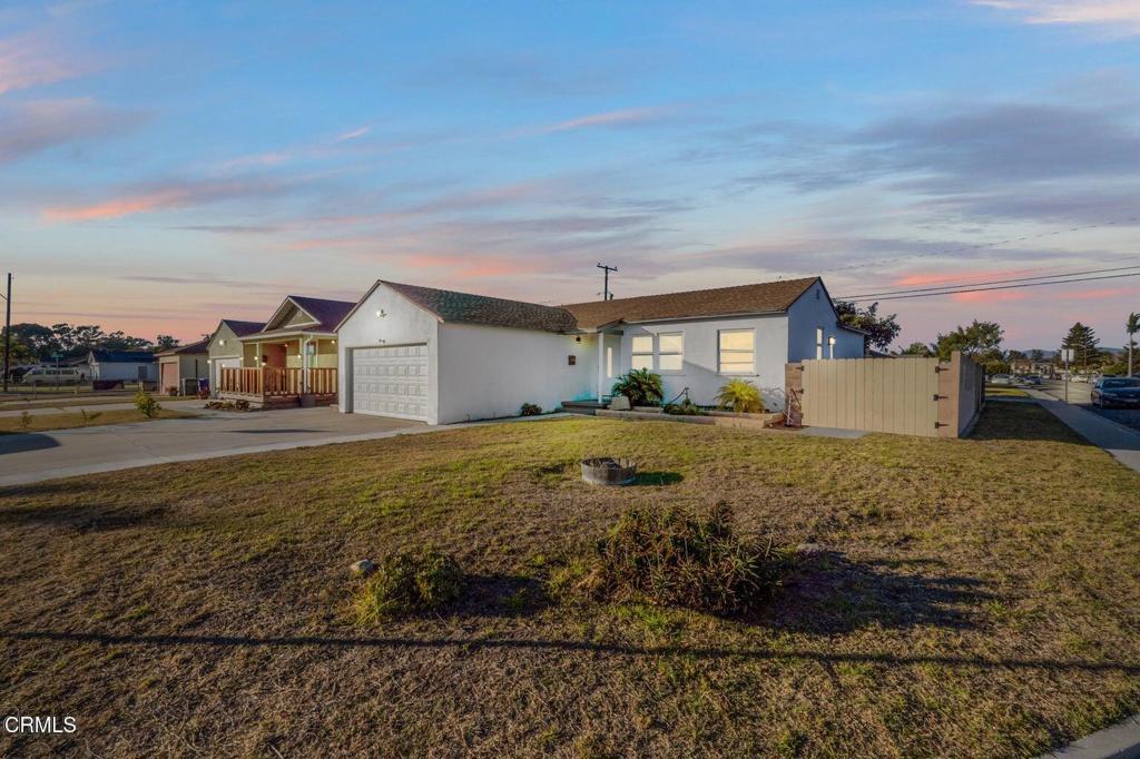 *Charming Corner-Lot Home in Port Hueneme** Discover this delightful 4-bedroom, 2-bathroom home offering 1,236 sq. ft. of living space on a generous 5,662 sq. ft. lot. Located on a corner, the property boasts a fresh white exterior, a spacious driveway, and an expansive front yard that adds to its curb appeal. Inside, the living and dining areas feature sleek laminate floors, creating a warm and inviting ambiance. The kitchen, separated by a convenient breakfast bar, is equipped with modern stainless steel appliances and pristine white cabinets, with direct access to the backyard. The three comfortable bedrooms come with mirrored closet doors and share a full bathroom complete with a shower and tub. The backyard is vast and perfect for relaxation or entertaining, featuring a beautiful mature tree for shade. Additional highlights include a spacious two-door garage with plenty of storage and a washer and dryer area. A true gem, this home offers style, comfort, and ample outdoor space in a desirable Port Hueneme location.