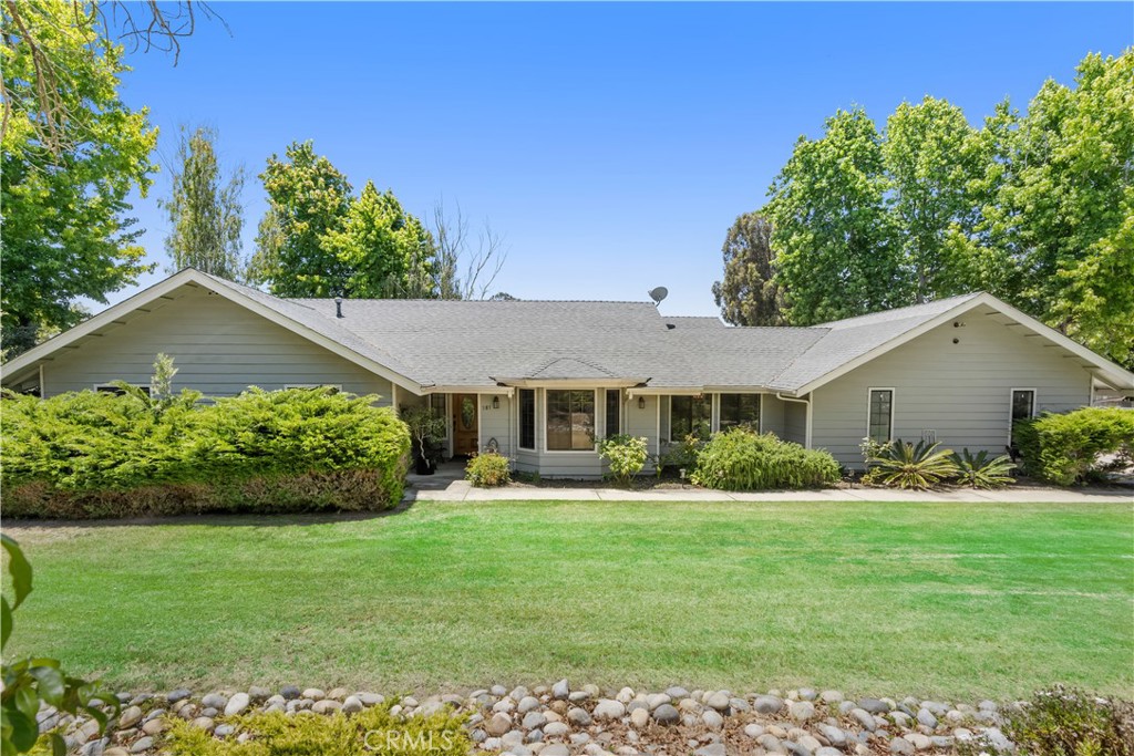 Polished, picturesque, and poised for the buyer seeking a single-level updated home on nearly one acre. The floor plan includes a formal living room with a classic bay window and opens to formal dining. The updated kitchen is gleaming with granite counters, stainless appliances, generous cabinets, and an extensive dining bar. This gourmet's kitchen opens to a large family room, warmed by a floor-to-ceiling brick fireplace and brightened by the accessible patio and backyard views. The large bedrooms include overhead fixtures and are surrounded by window-framed landscaped vistas. The large primary suite with adjoining bath and walk-in closet features patio and backyard access. The laundry room includes additional cabinets and counter space. The oversized finished garage has wide driveway access plus room for RV parking. The parcel provides lush landscaping surrounding this lovely home, with a second driveway to access a separate, fenced backyard--ideal for hobbies, horses, a second garage/workshop, or ADU potential. This private setting offers secluded, retreat-style living, yet it is conveniently close to stores, restaurants, and commuter Highway 101 access. Welcome home!