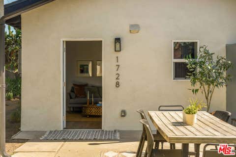 Photo of 1728 52nd Street, Los Angeles, CA 90062 (MLS # 26857597)