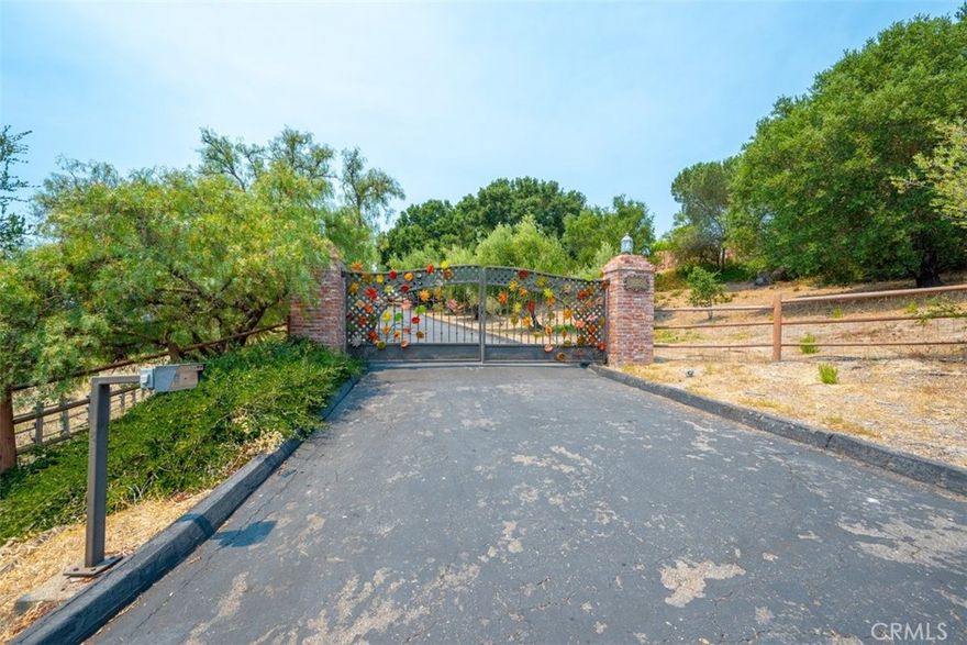 PRICE REDUCED!!!

Nestled in the coveted Corbett Highlands area off Corbett Canyon in Arroyo Grande—equidistant between the village of Arroyo Grande and downtown San Luis Obispo—this 5-bedroom, 4-bath single-level estate blends refined luxury with just the right touch of rural charm. Set on nearly 6 private acres, the property offers sweeping views of Edna Valley wine country and rolling hills. 



Upon arrival at the gated entry, featuring custom-made glass-leaf detailing, a circular drive, and generous parking, sets the tone for a home that is as welcoming as it is impressive. Step inside the entryway to a great room featuring beamed ceilings, a cast-iron wood-burning stove fireplace with brick surround, and double French doors that open to the front outdoor living space. 



The chef’s kitchen features a grand island with a gas range, a custom refrigerator, double ovens, artisanal lighting, designer glass accents, and ample cabinetry—plus a large walk-in pantry for added convenience. The adjacent formal dining room features a seamless indoor-outdoor flow, accessible through sliding glass doors that open onto the backyard.



The primary suite is a retreat of its own, complete with a cozy fireplace, a window-seat reading corner, dual closets, and a luxurious ensuite bath with soaking tub, glass-enclosed shower, dual vanities, and custom finishes throughout.



Additional highlights include:

•Flexible ADU/Game Room with its own kitchen, bath, fireplace, and French doors leading to the backyard. 

•Massive drive-through workshop with office—ideal for vehicle storage, hobbies, or business use. Additionally, there is another building and a temporary storage shed. 

•Whole house fan, x2 Attic fans that are temperature regulated, central HVAC, surround sound system, and thoughtful designs for modern comfort.

•Multiple outdoor entertaining spaces for gatherings, large or small.

•New roof installed in 2025.

•X4 animal shelters, Chicken coop, Greenhouse, Vegetable garden with gopher-resistant raised beds.

•Over 50 rose bushes, all identified.

•This estate could also be suitable for horses and other livestock. The property has recently been home to goats and alpacas— making it ideal for 4-H projects. 



Regarding insurance, we have identified some affordable and available options that do not include the CA Fair plan.



Offering privacy, functionality, and timeless elegance, this single-level Corbett Highlands estate is a home to enjoy for generations.