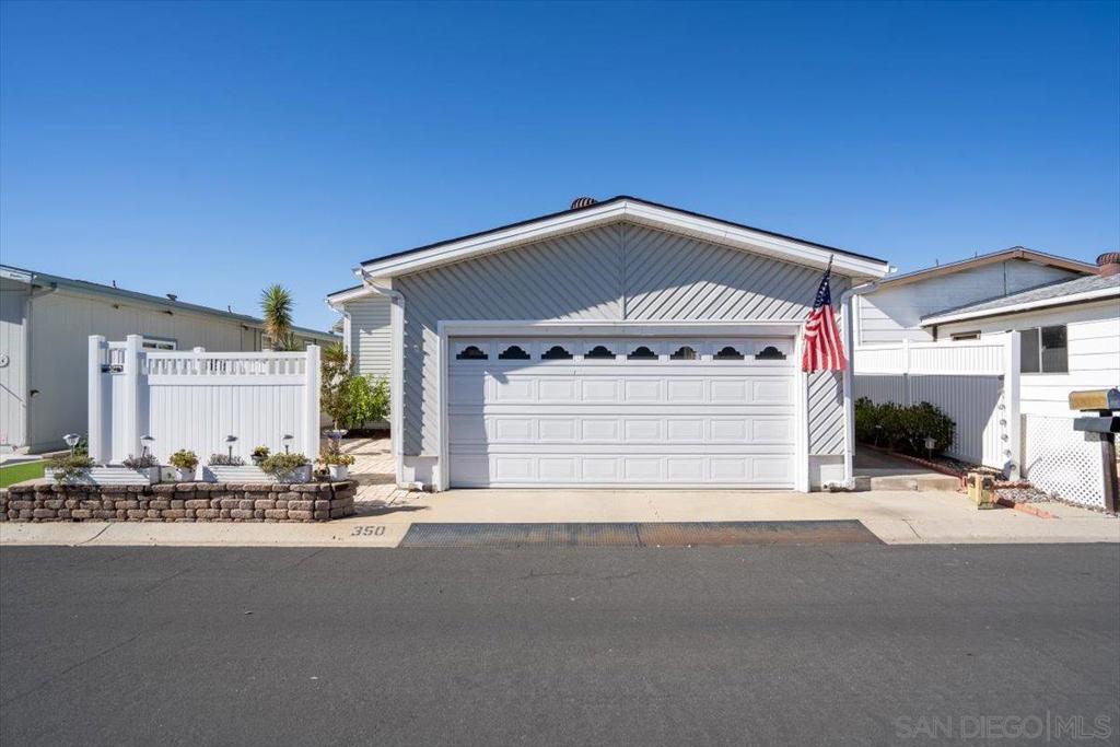 Upgraded & well-maintained home with full length covered side patio to enjoy a cool breeze in the shade, along with a large back patio. Backs up to the river park (no one behind). Turn-key, move in ready, light & bright open floor plan, 2 car garage with high ceiling, large bonus room could be a third bedroom. This is one of the most sought after, & best located 55+ parks in all of East County.