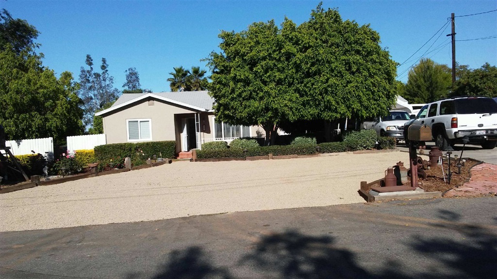 Country living at its best. This home has it all. Remodeled interior with 3 bedrooms and 2 full baths Fireplace in entry Dining Room and wood stove in Family room. New flooring throughout. Large country kitchen with tons of cupboard space. Open the doors to your large 16'X51' deck overlooking a gardeners paradise. Mature Palm trees and many fruit trees for the family, and chicken coop. Meandering pathways throughout the yard. Single entry street with good visibility makes this a safe place for the family. Neighborhoods: Fallbrook Equipment: Garage Door Opener, Shed(s) Other Fees: 0 Sewer: Sewer Connected Topography: LL