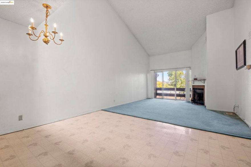 Wonderful opportunity to own a spacious tri-level condominium unit. This top-floor unit features a large additional open loft space, perfect for a home office, playroom, or even an additional bedroom.  Enjoy soaring vaulted ceilings, a cozy fireplace, and two private balconies that provide great indoor-outdoor flow. The thoughtfully designed layout includes a lower level with a generously sized primary suite, large walk-in closet, and a full bath. The main level includes the second bedroom and bathroom, kitchen, dining area, and living room with great natural light, plus in-unit laundry with a stacked front-loading washer and gas dryer.  Community amenities include a pool, hot tub, tennis court, elevator access, and two assigned parking spaces in a gated garage. With easy access to I-80, AC Transit, Contra Costa College, shopping, and restaurants, this well-located condo offers both comfort and convenience.  Don’t miss your chance to own one of the largest floor plans in the complex!